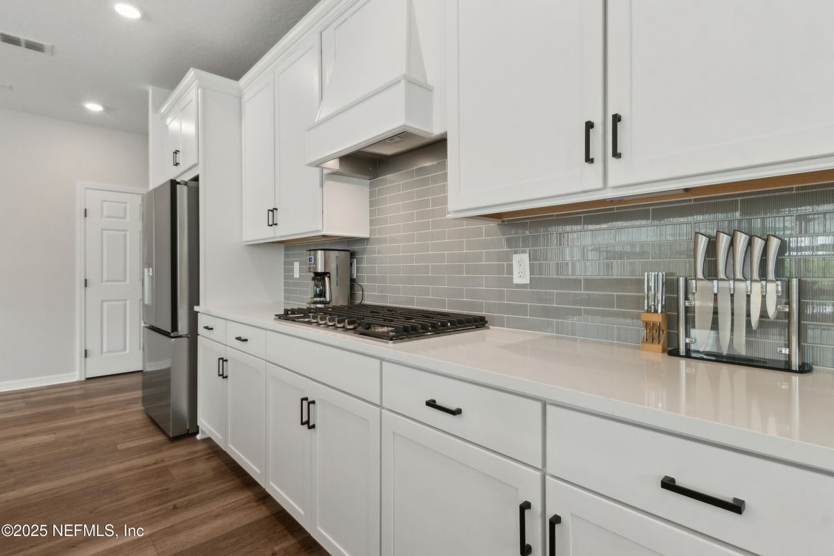 Interior, Kitchen, Recessed Lighting, Tile Countertops, Wood Texture Flooring