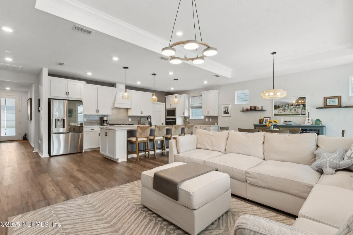 Dining room, Interior, Kitchen, Living room, Pendant Lights, Recessed Lighting, Stainless Steel Appliances, Wood Texture Flooring