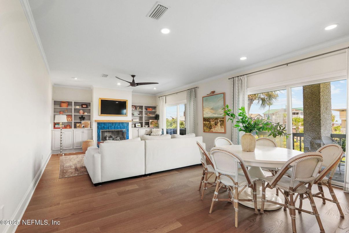 Dining room, Fireplace, Interior, Living room, Recessed Lighting, Wood Texture Flooring