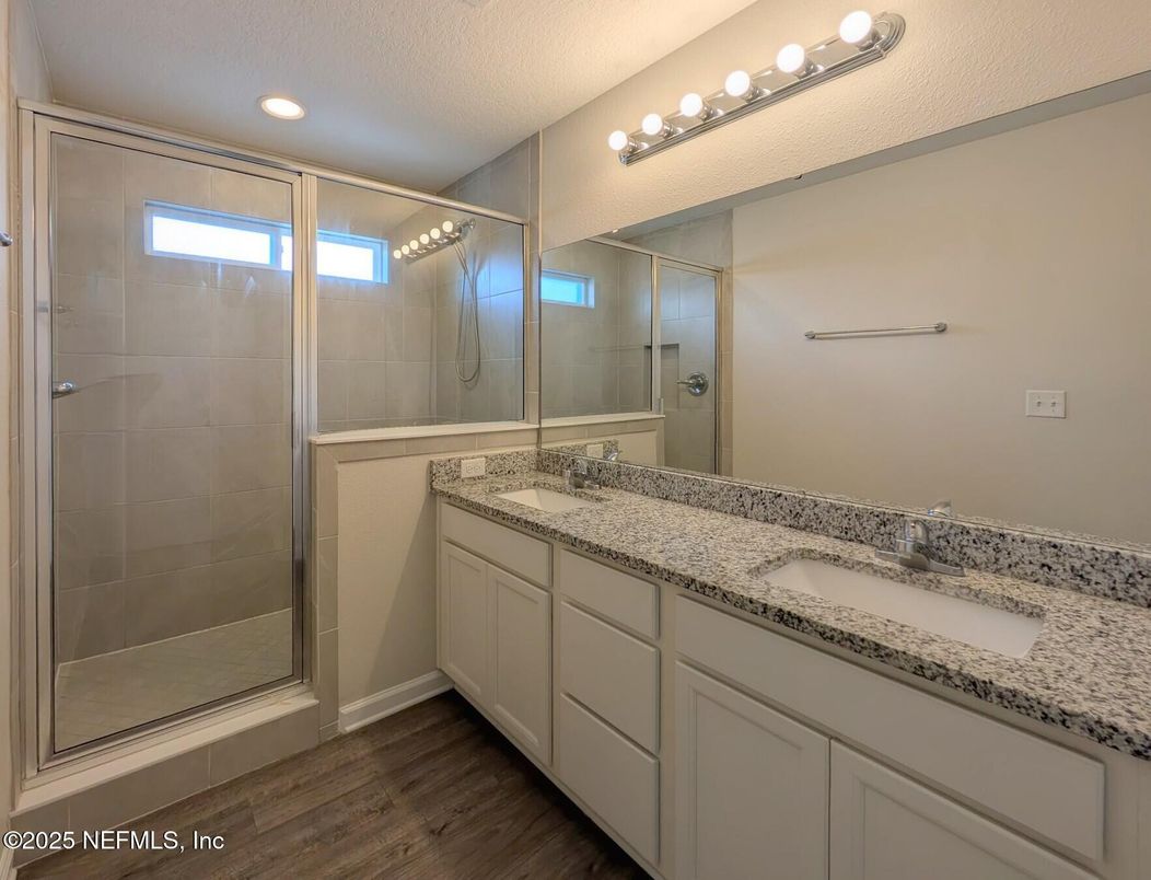Bathroom, Dual Sink Vanities, Glass Shower, Interior, Recessed Lighting, Wood Texture Flooring