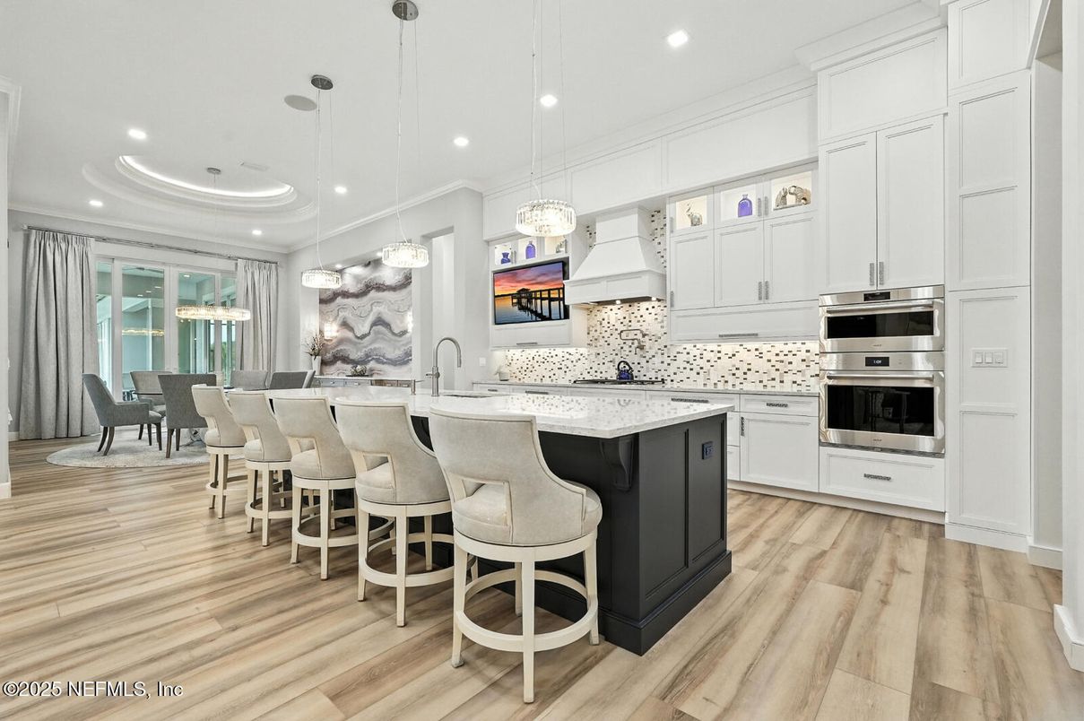 Dining room, Interior, Kitchen, Pendant Lights, Recessed Lighting, Stainless Steel Appliances, Wood Texture Flooring
