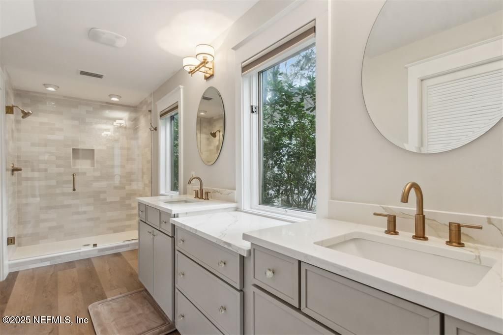 Bathroom, Dual Sink Vanities, Glass Shower, Interior, Recessed Lighting, Wood Texture Flooring