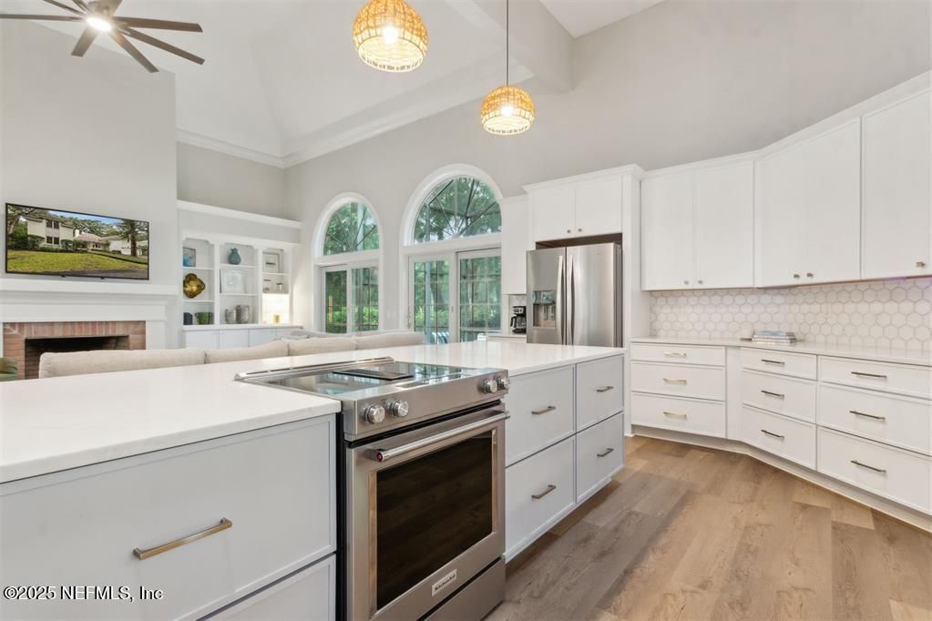Fireplace, Interior, Kitchen, Pendant Lights, Stainless Steel Appliances, Wood Texture Flooring