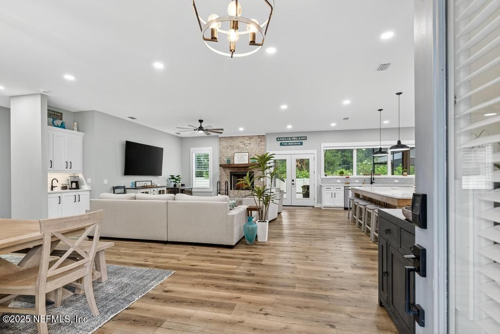 Dining room, Fireplace, Interior, Kitchen, Living room, Pendant Lights, Recessed Lighting, Stone Walls, Wood Texture Flooring
