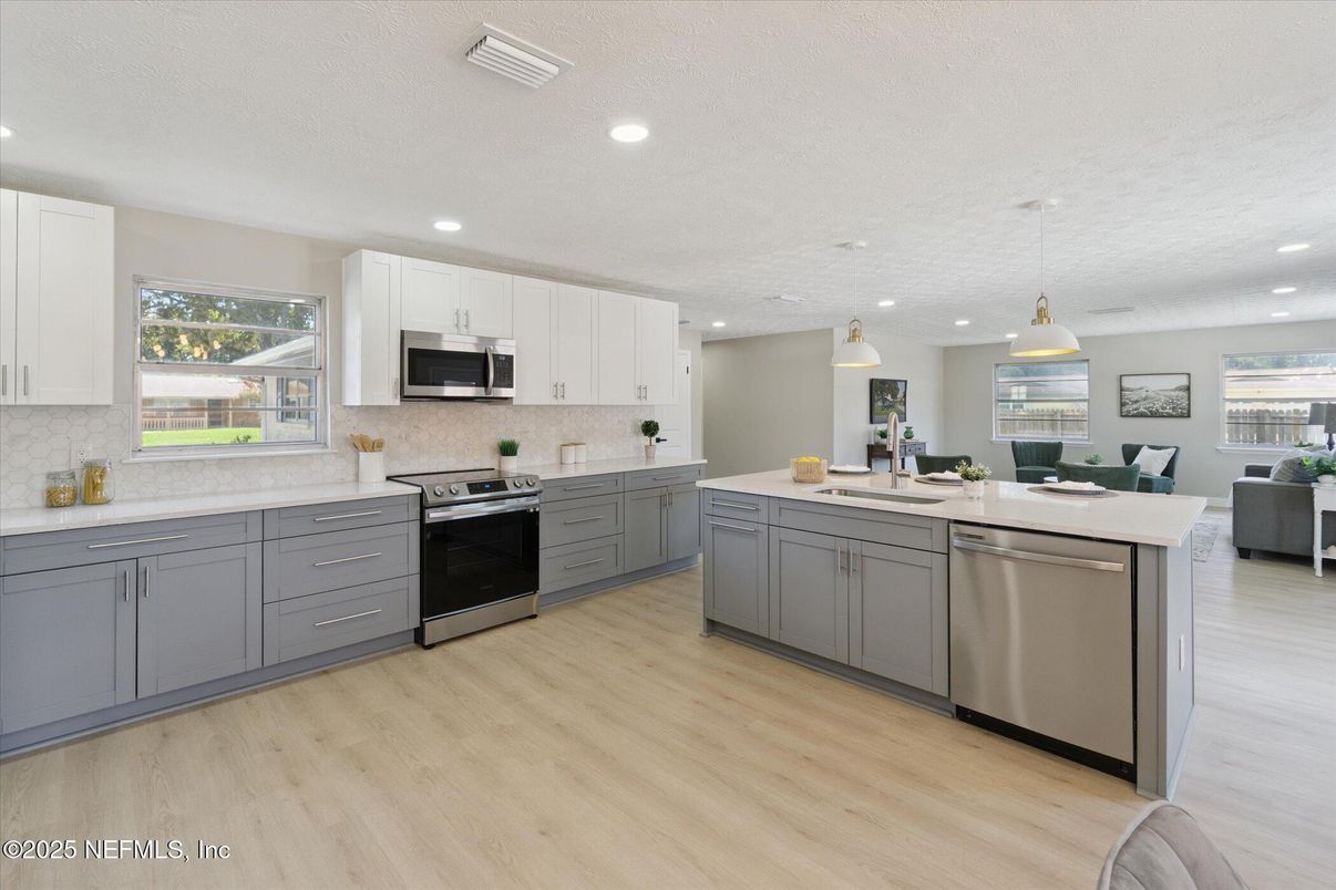 Dining room, Interior, Kitchen, Pendant Lights, Recessed Lighting, Stainless Steel Appliances, Wood Texture Flooring