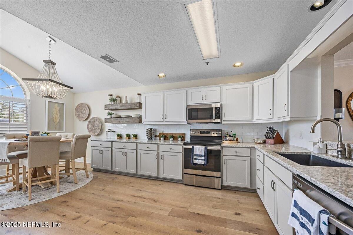 Dining room, Interior, Kitchen, Pendant Lights, Recessed Lighting, Stainless Steel Appliances, Wood Texture Flooring
