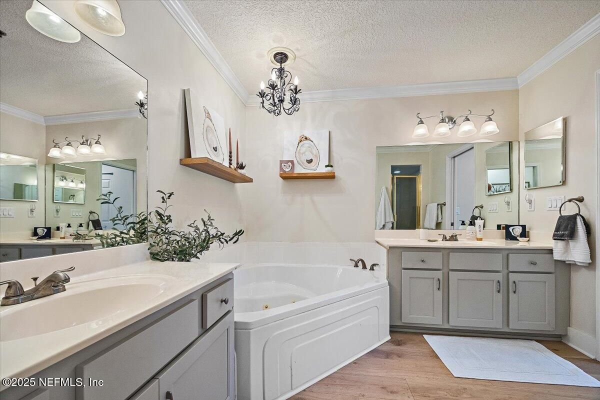 Bathroom, Chandelier, Dual Sink Vanities, Interior, Wood Texture Flooring