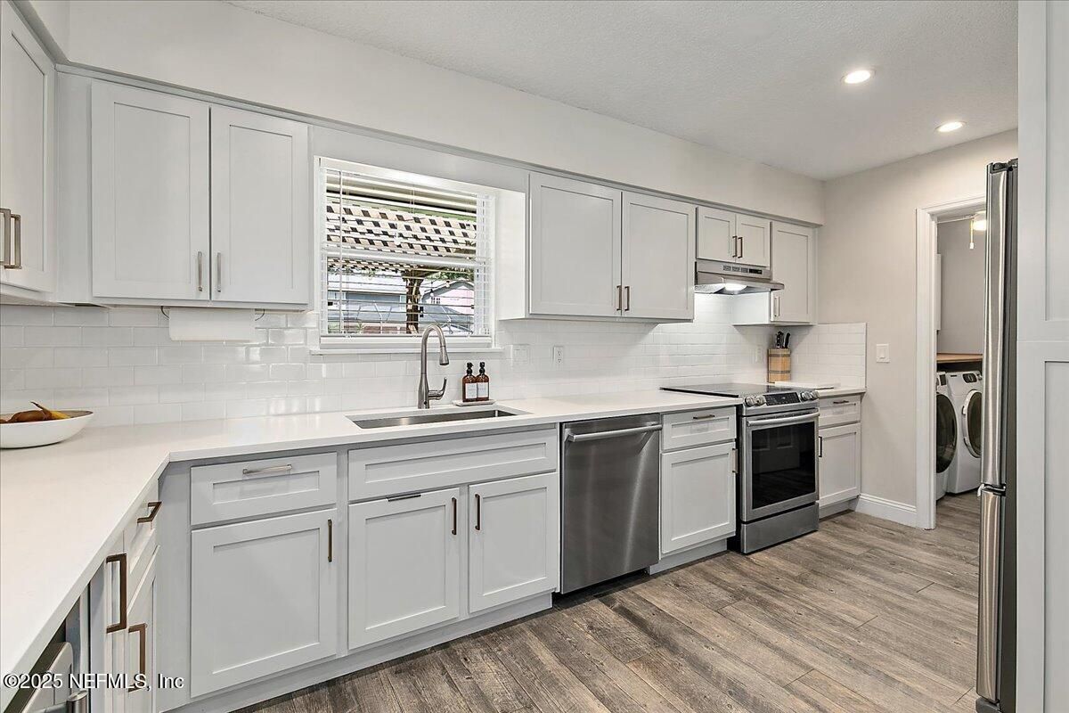 Interior, Kitchen, Recessed Lighting, Stainless Steel Appliances, Washer, Wood Texture Flooring