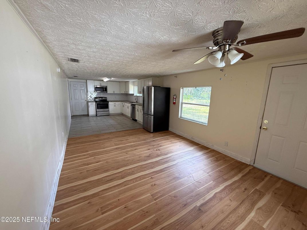 Empty room, Interior, Kitchen, Stainless Steel Appliances, Wood Texture Flooring