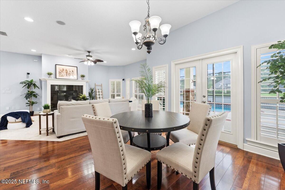 Chandelier, Dining room, Fireplace, Interior, Living room, Recessed Lighting, Wood Texture Flooring