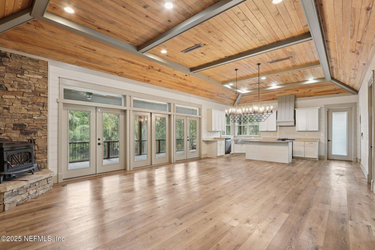 Chandelier, Empty room, Fireplace, Interior, Kitchen, Pendant Lights, Recessed Lighting, Stone Walls, Wooden Beams, Wooden Ceilings, Wood Texture Flooring