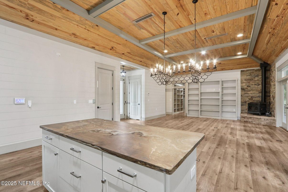 Empty room, Fireplace, Interior, Recessed Lighting, Stone Walls, Wooden Beams, Wooden Ceilings, Wood Texture Flooring