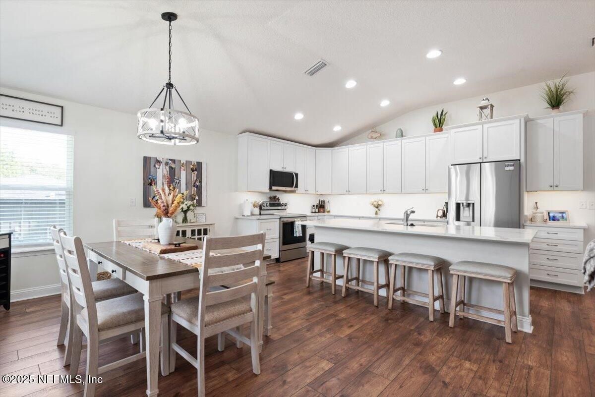 Dining room, Interior, Kitchen, Pendant Lights, Recessed Lighting, Stainless Steel Appliances, Wood Texture Flooring