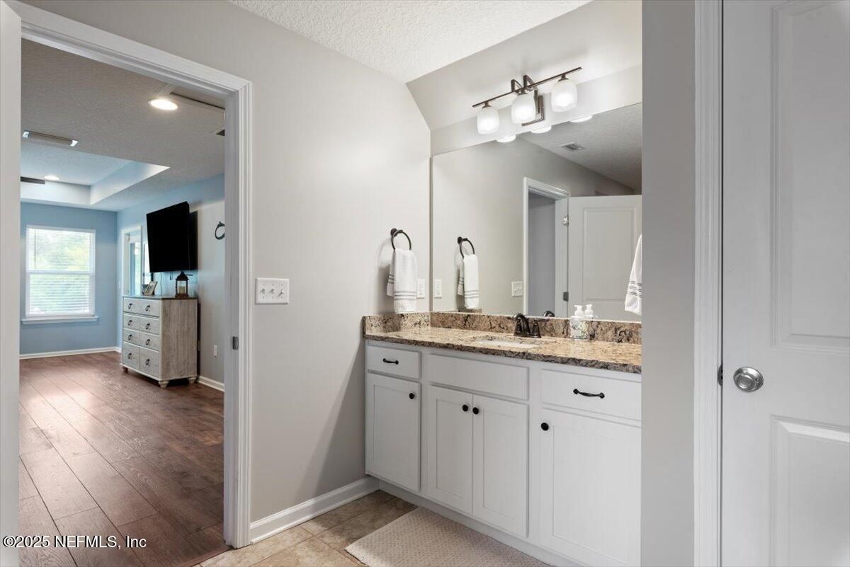 Bathroom, Dual Sink Vanities, Interior, Recessed Lighting, Wood Texture Flooring