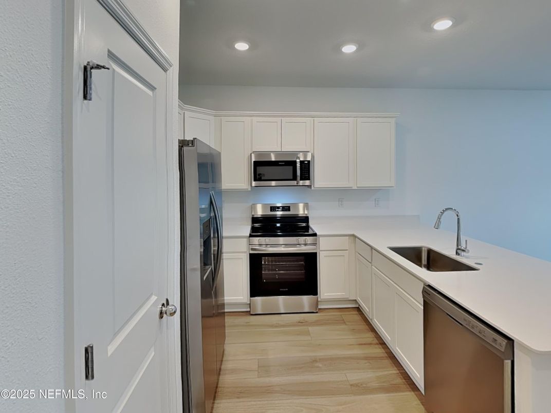 Interior, Kitchen, Recessed Lighting, Stainless Steel Appliances, Wood Texture Flooring