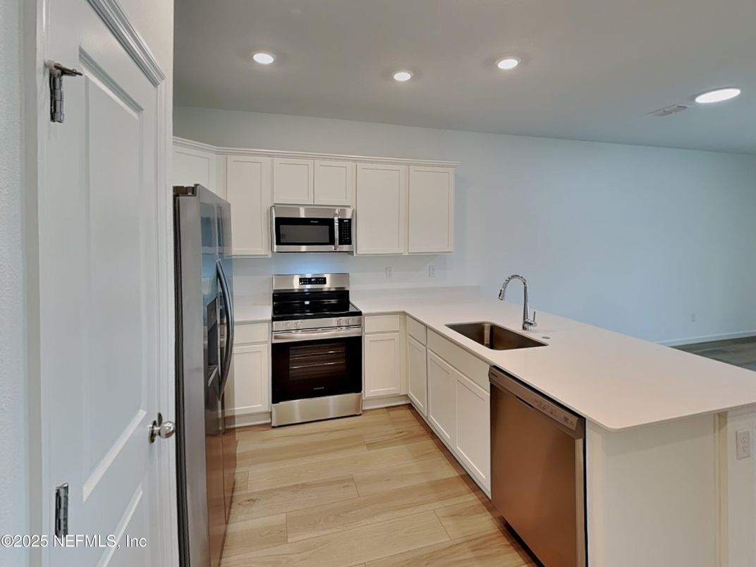 Interior, Kitchen, Recessed Lighting, Stainless Steel Appliances, Wood Texture Flooring