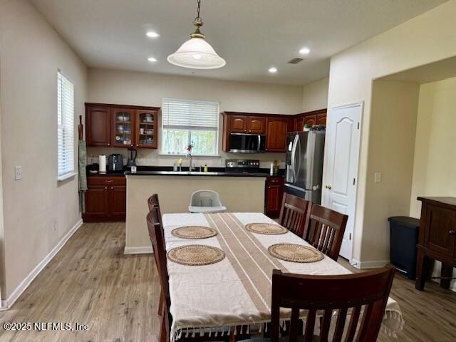 Dining room, Interior, Kitchen, Pendant Lights, Recessed Lighting, Stainless Steel Appliances, Wood Texture Flooring