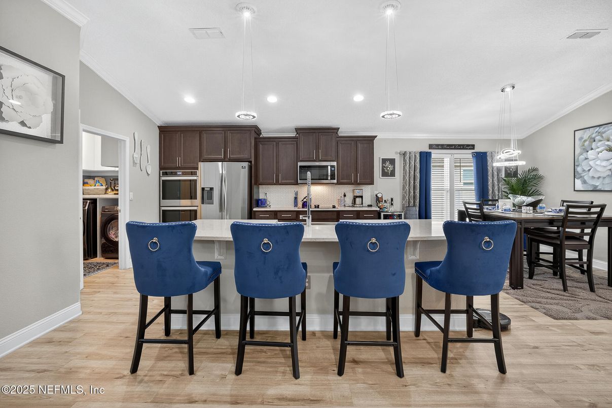Dining room, Interior, Kitchen, Pendant Lights, Recessed Lighting, Stainless Steel Appliances, Wood Texture Flooring