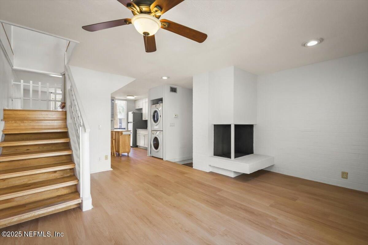 Fireplace, Interior, Recessed Lighting, Washer, Wood Texture Flooring