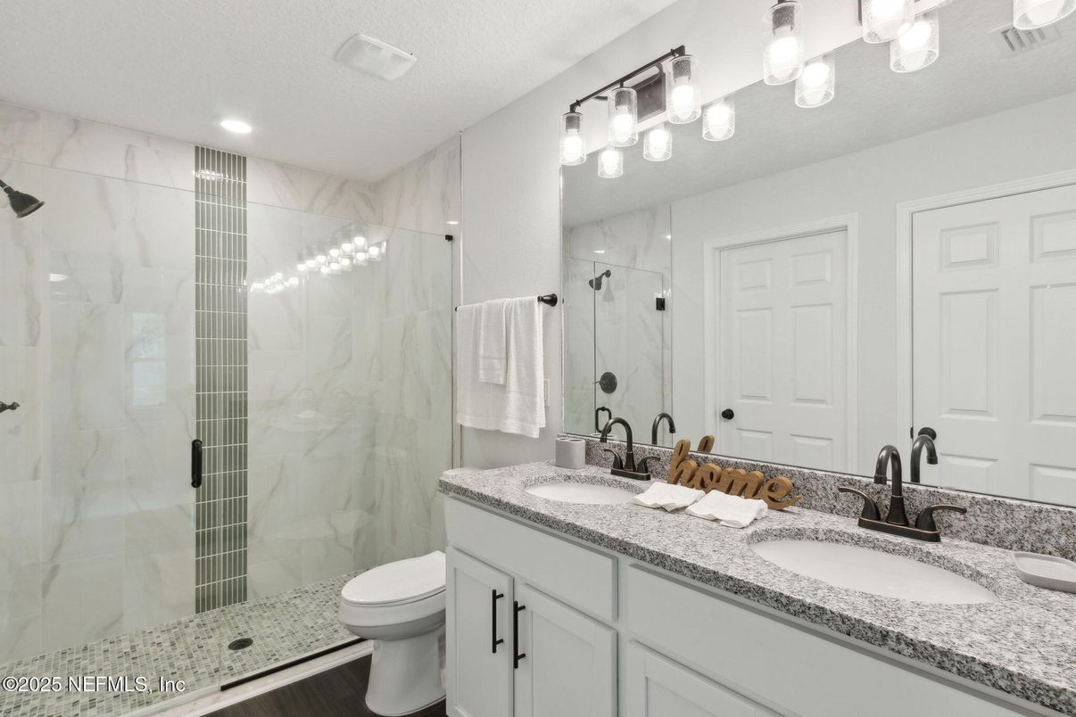 Bathroom, Dual Sink Vanities, Glass Shower, Interior, Marble Walls, Recessed Lighting