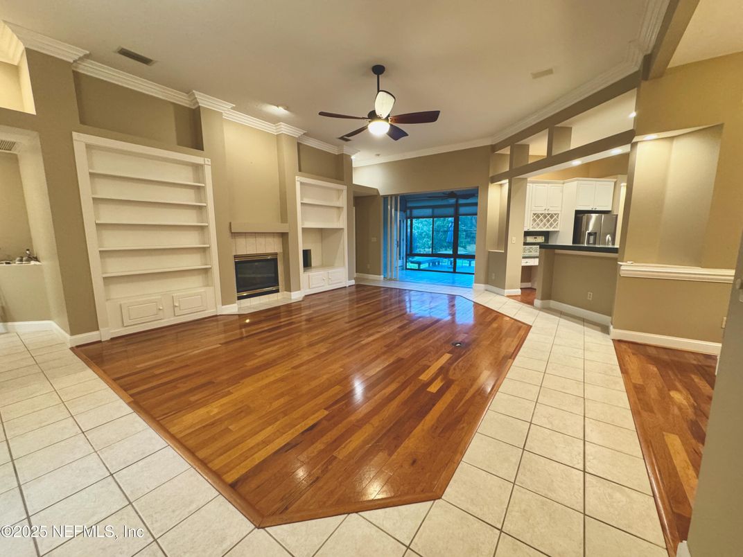 Empty room, Fireplace, Interior, Kitchen, Stainless Steel Appliances, Wood Texture Flooring