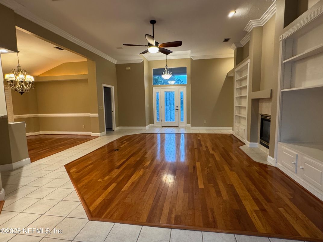 Chandelier, Empty room, Fireplace, Interior, Recessed Lighting, Wood Texture Flooring