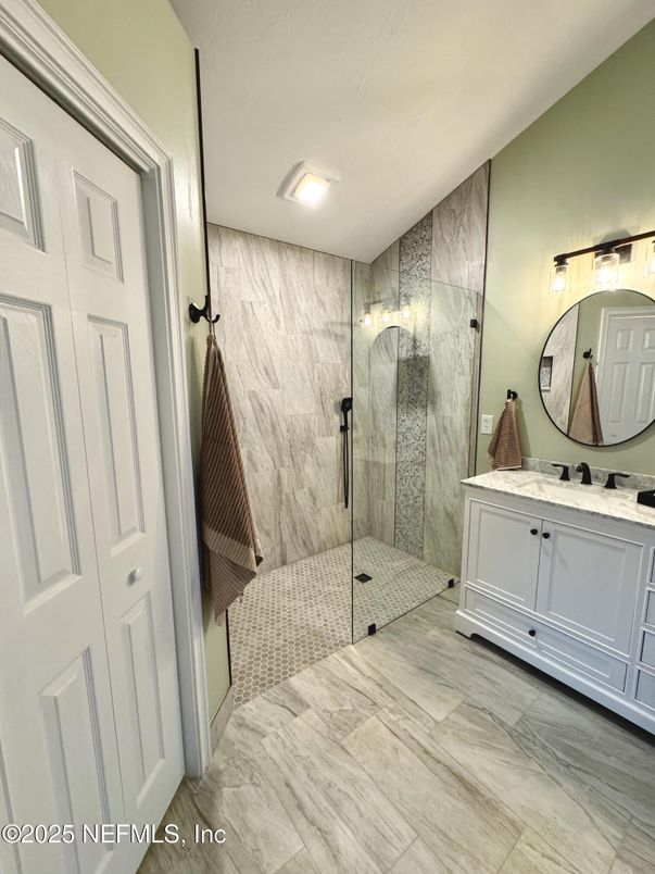 Bathroom, Glass Shower, Interior, Marble Walls, Recessed Lighting, Wood Texture Flooring