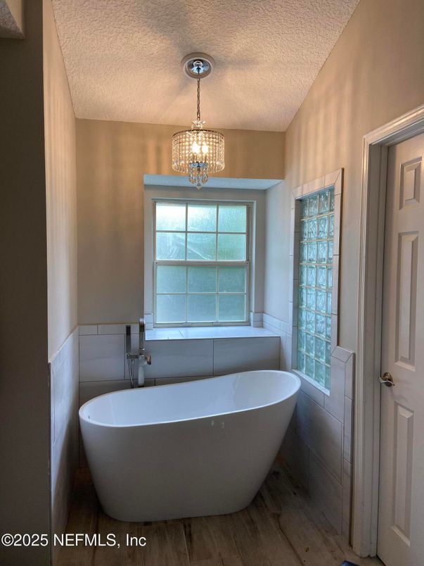 Bathroom, Chandelier, Free Standing Baths, Interior, Pendant Lights, Wood Texture Flooring