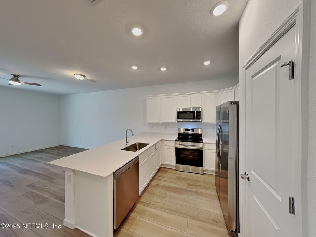 Interior, Kitchen, Recessed Lighting, Stainless Steel Appliances, Wood Texture Flooring