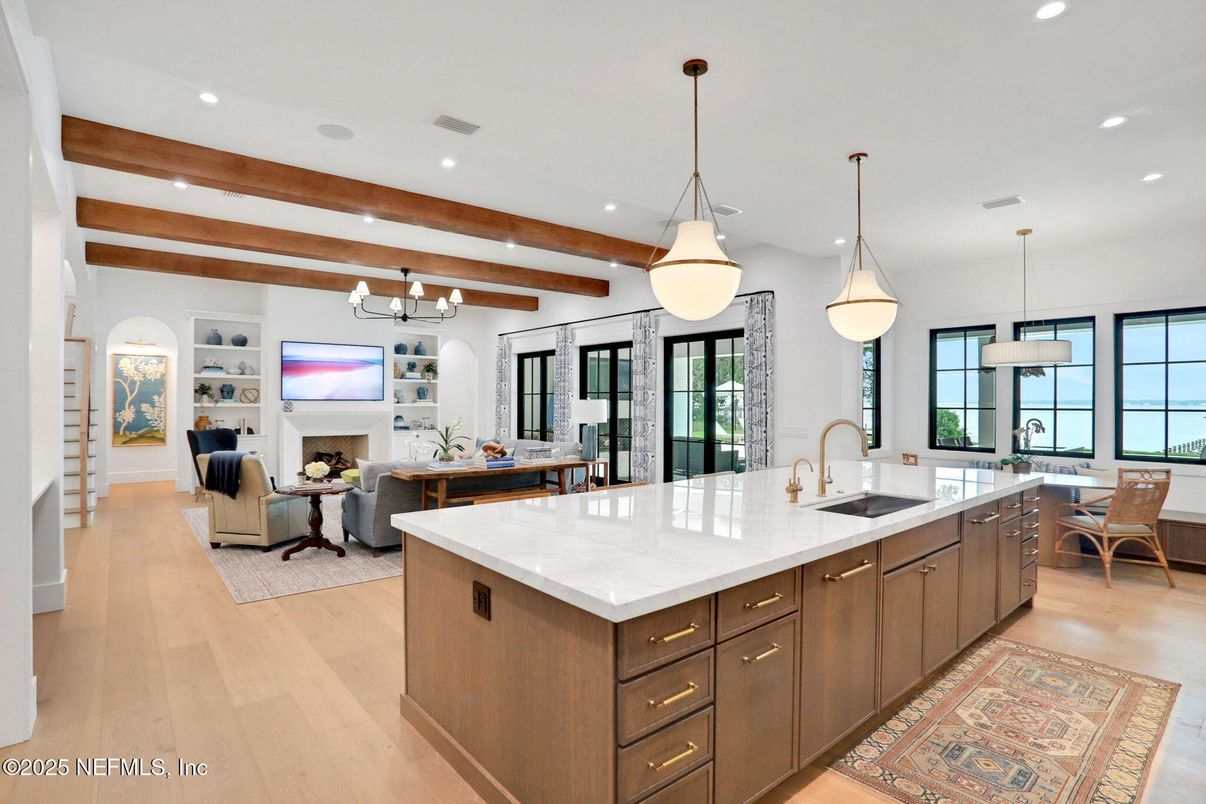Dining room, Fireplace, Interior, Kitchen, Living room, Pendant Lights, Recessed Lighting, Water, Wooden Beams, Wood Texture Flooring