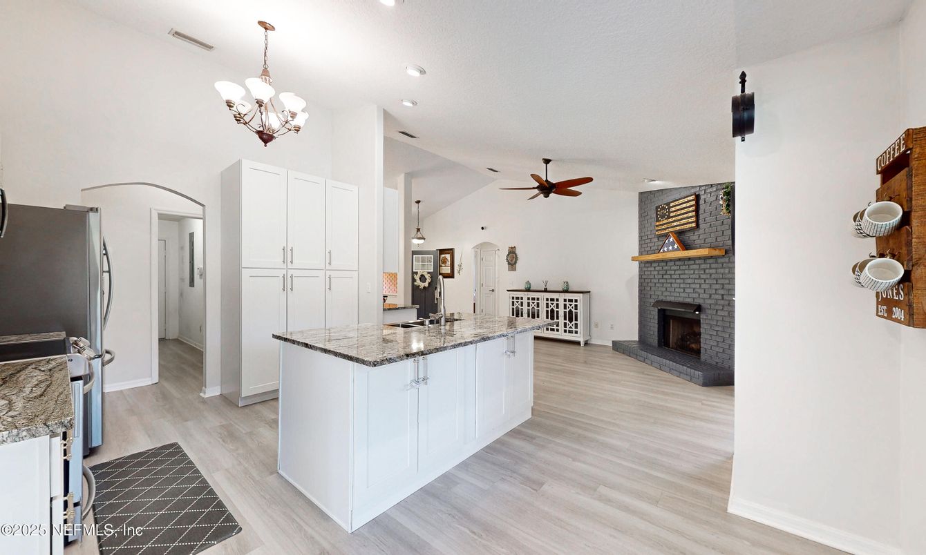 Chandelier, Fireplace, Interior, Kitchen, Recessed Lighting, Wood Texture Flooring