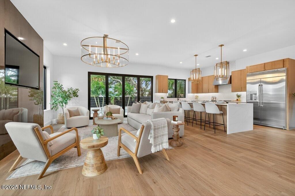 Chandelier, Interior, Kitchen, Living room, Pendant Lights, Recessed Lighting, Stainless Steel Appliances, Wood Texture Flooring