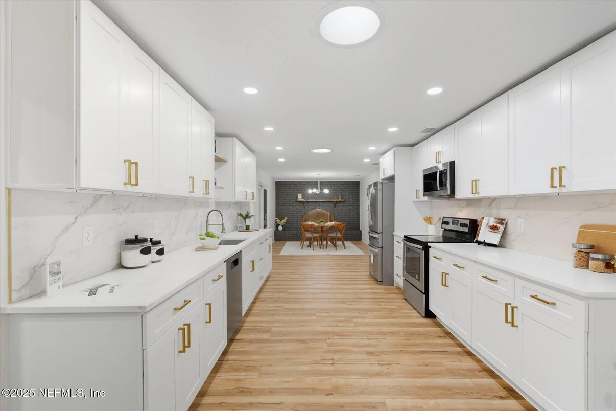 Dining room, Interior, Kitchen, Marble Walls, Recessed Lighting, Stainless Steel Appliances, Wood Texture Flooring