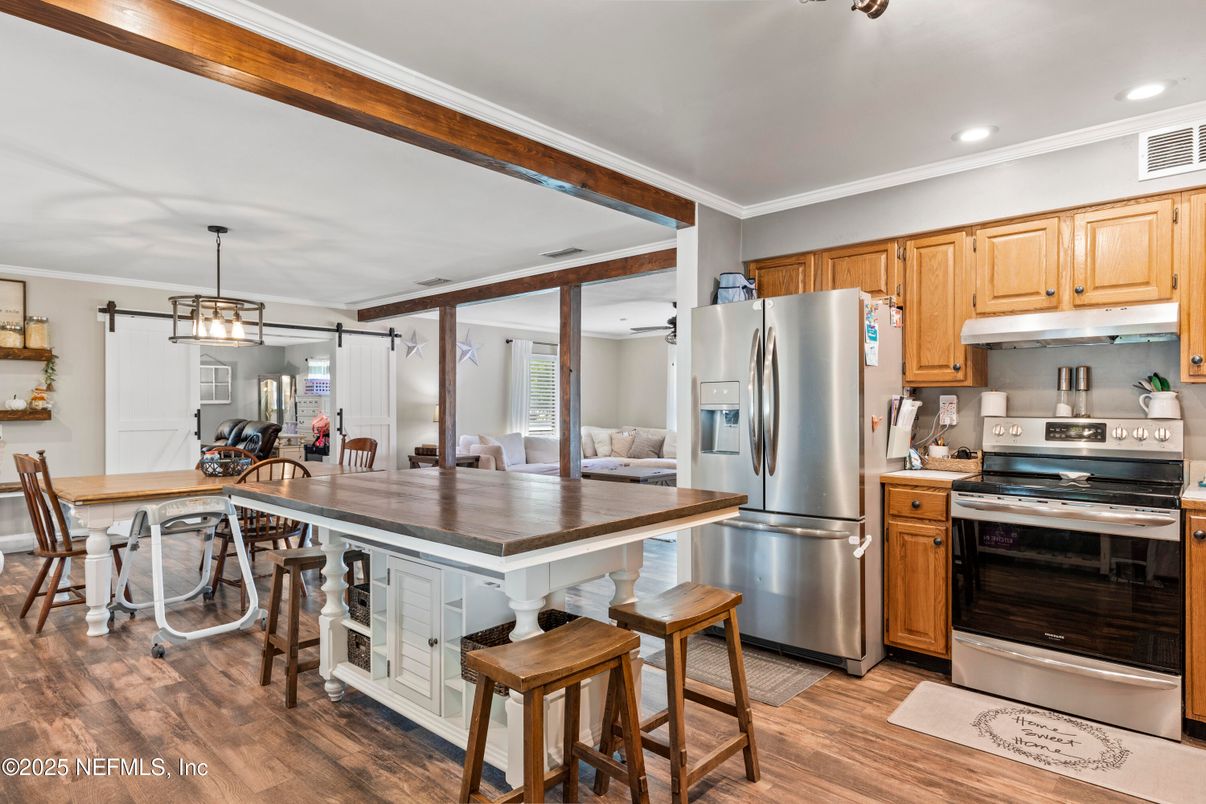 Dining room, Interior, Kitchen, Pendant Lights, Recessed Lighting, Stainless Steel Appliances, Wood Texture Flooring