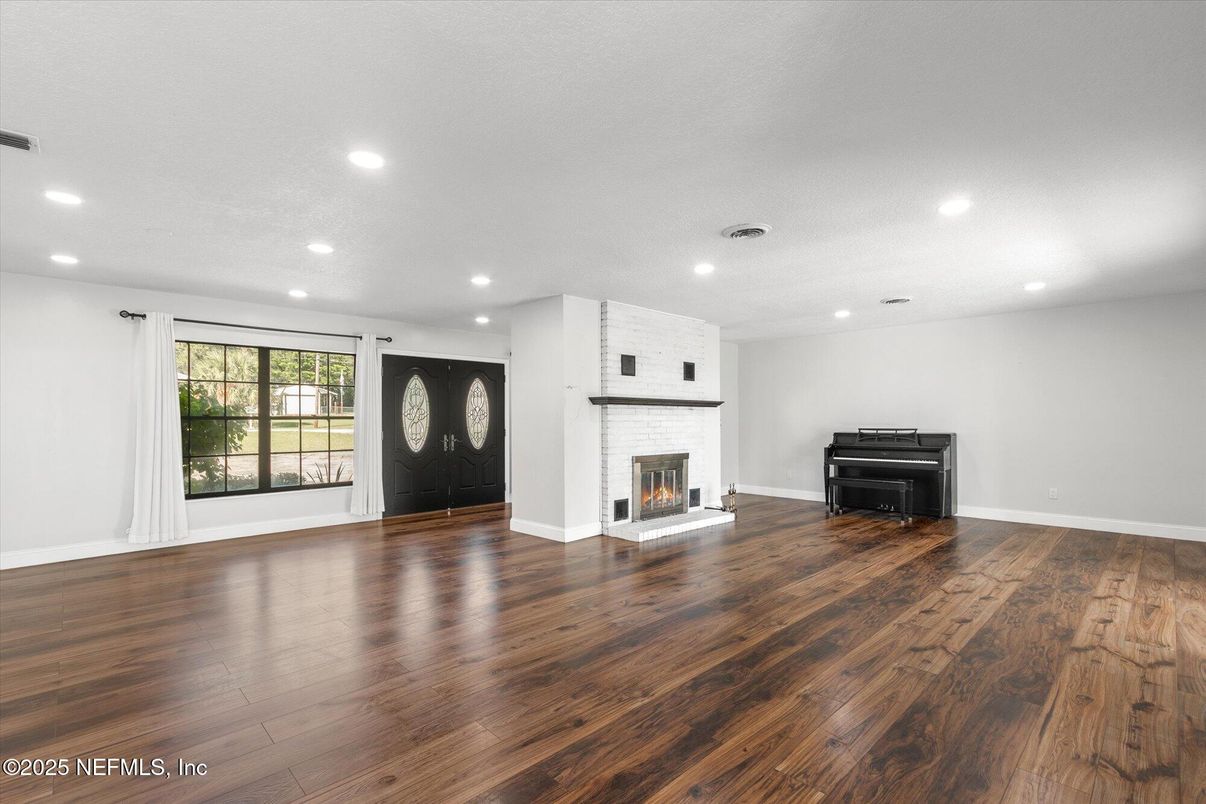 Empty room, Fireplace, Interior, Piano, Recessed Lighting, Wood Texture Flooring