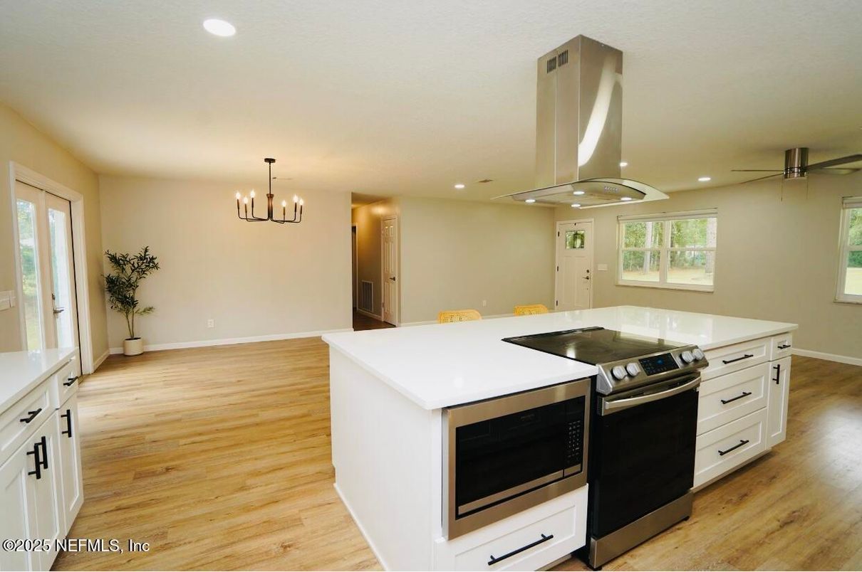 Chandelier, Interior, Kitchen, Pendant Lights, Recessed Lighting, Stainless Steel Appliances, Wood Texture Flooring