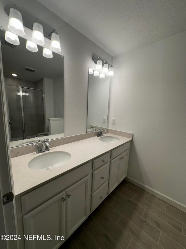 Bathroom, Dual Sink Vanities, Glass Shower, Interior, Wood Texture Flooring