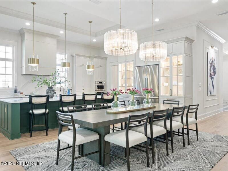 Chandelier, Dining room, Interior, Kitchen, Pendant Lights, Recessed Lighting, Stainless Steel Appliances, Wood Texture Flooring