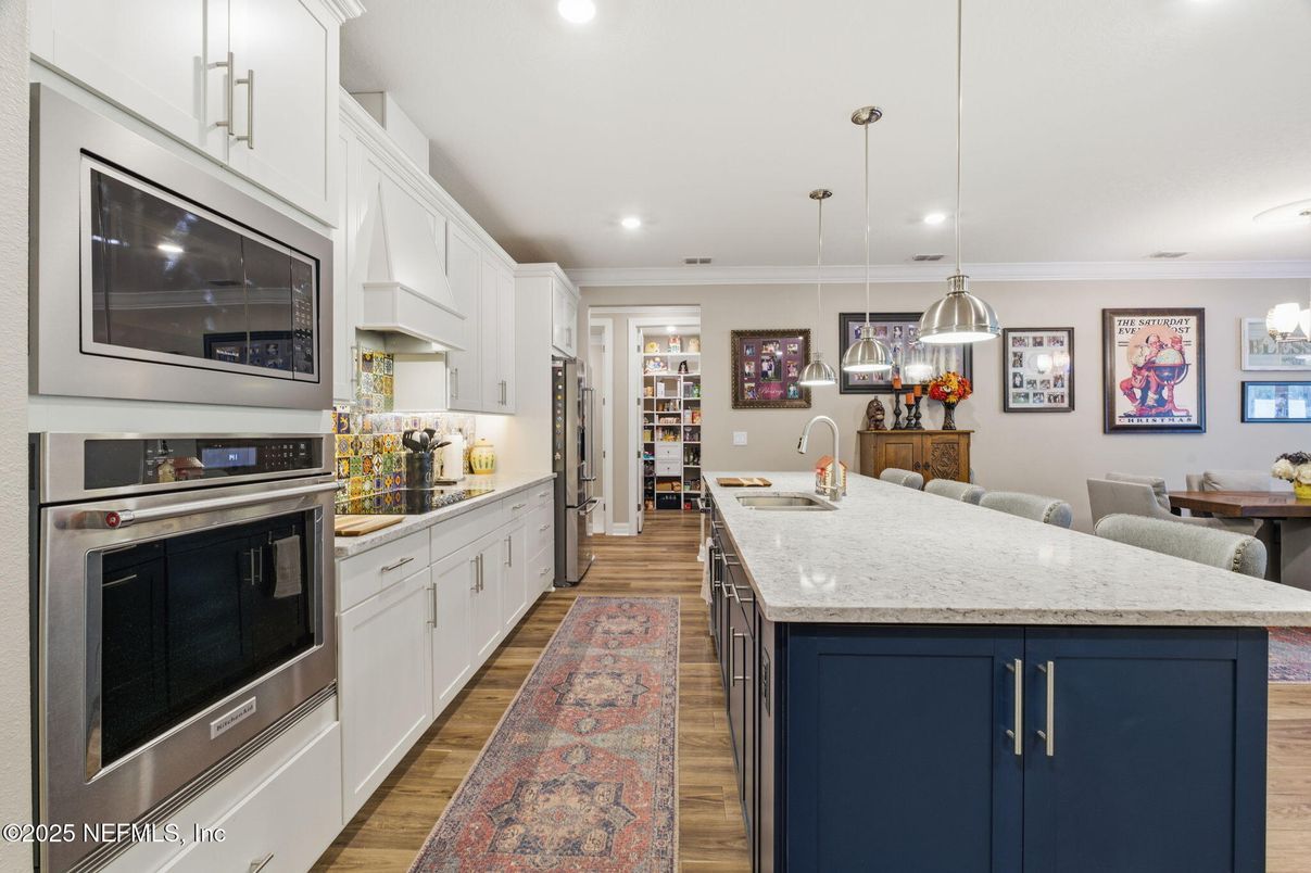 Dining room, Interior, Kitchen, Pendant Lights, Recessed Lighting, Stainless Steel Appliances, Wood Texture Flooring