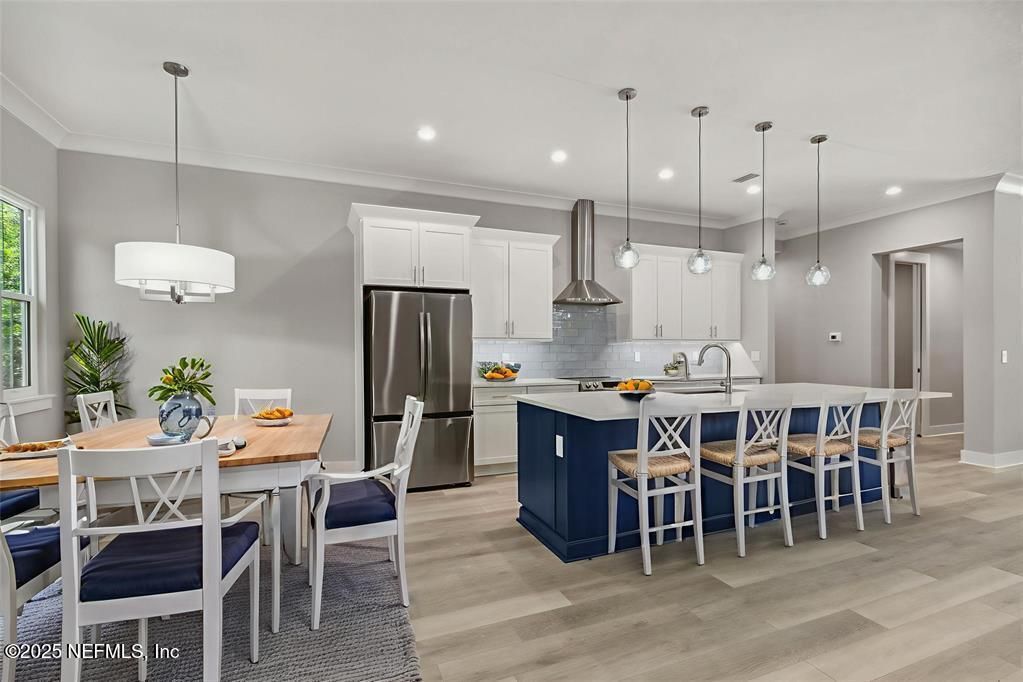Dining room, Interior, Kitchen, Pendant Lights, Recessed Lighting, Stainless Steel Appliances, Wood Texture Flooring