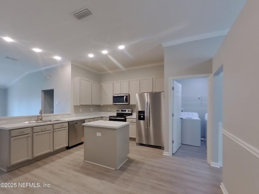 Interior, Kitchen, Recessed Lighting, Stainless Steel Appliances, Washer, Wood Texture Flooring