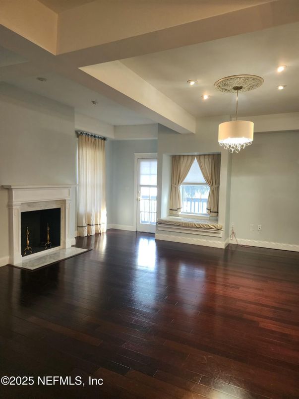 Chandelier, Empty room, Fireplace, Interior, Recessed Lighting, Wood Texture Flooring