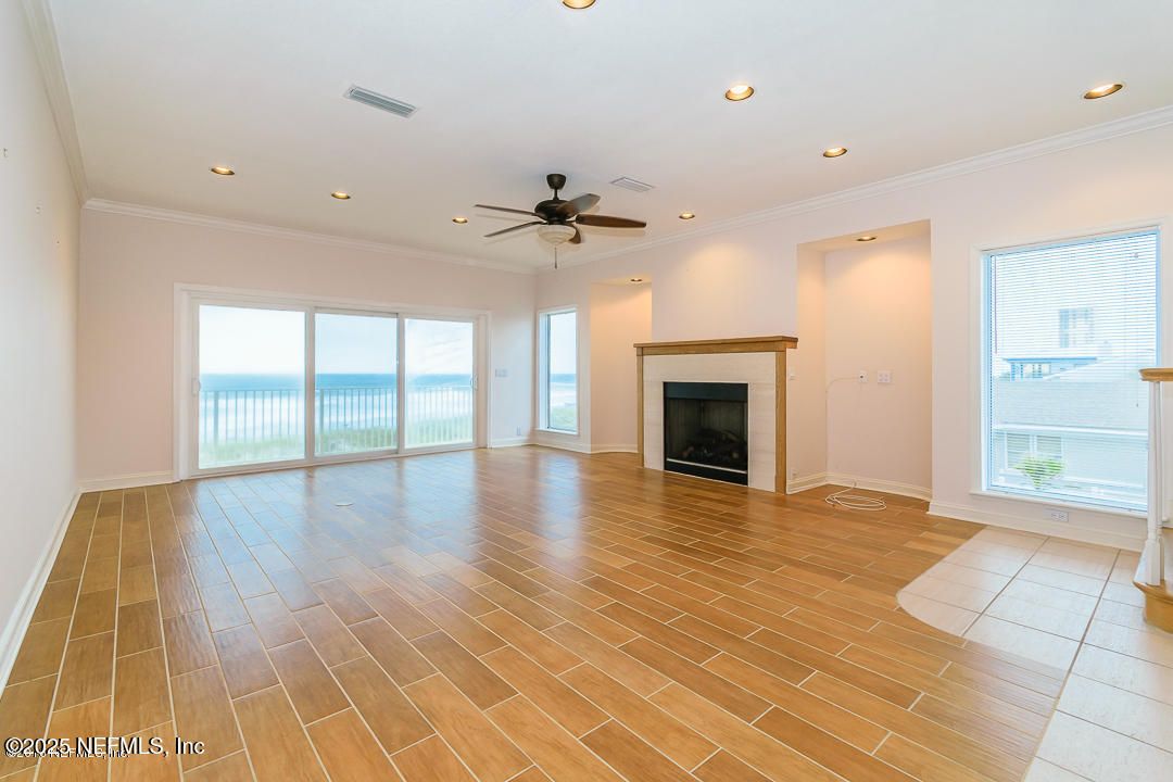 Empty room, Fireplace, Interior, Recessed Lighting, Water, Wood Texture Flooring