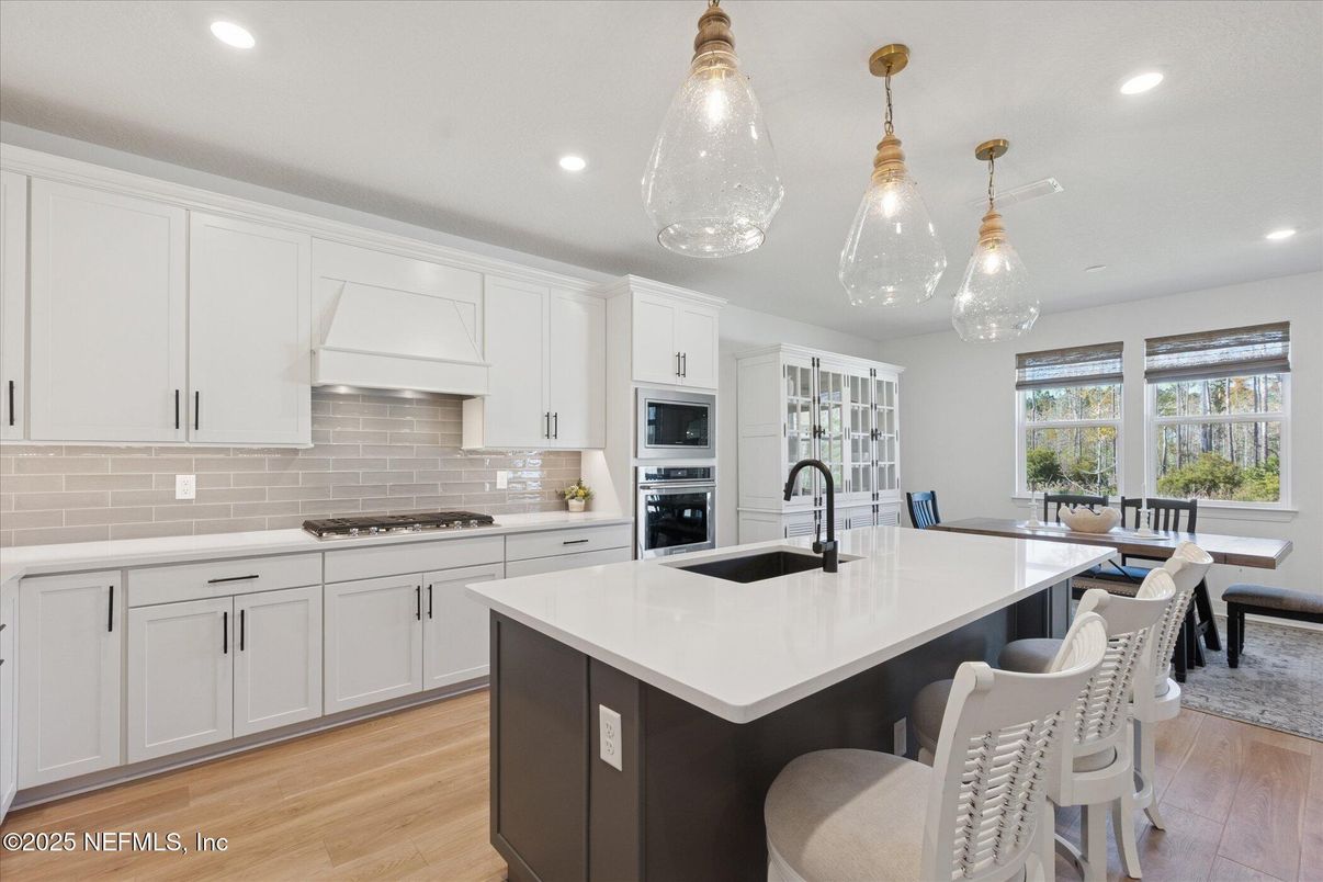 Dining room, Interior, Kitchen, Pendant Lights, Recessed Lighting, Stainless Steel Appliances, Wood Texture Flooring