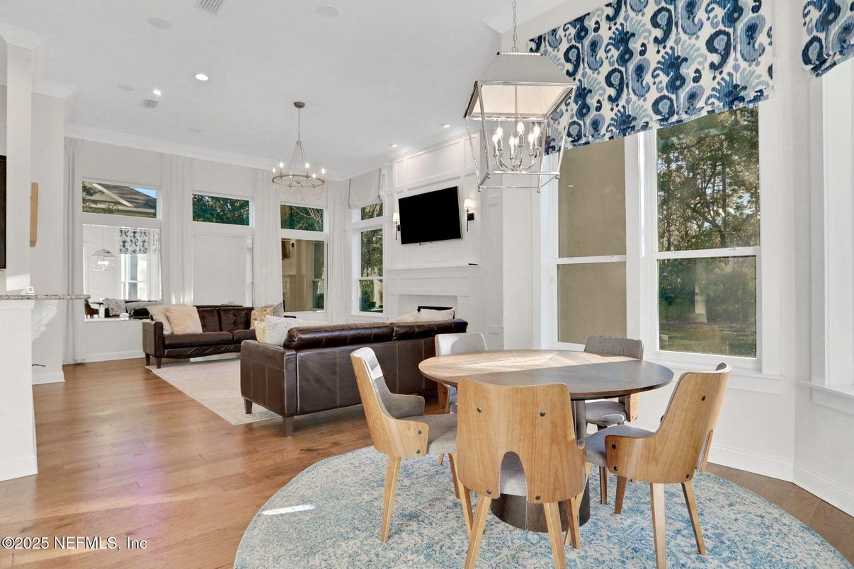 Chandelier, Dining room, Fireplace, Interior, Living room, Pendant Lights, Recessed Lighting, Wood Texture Flooring