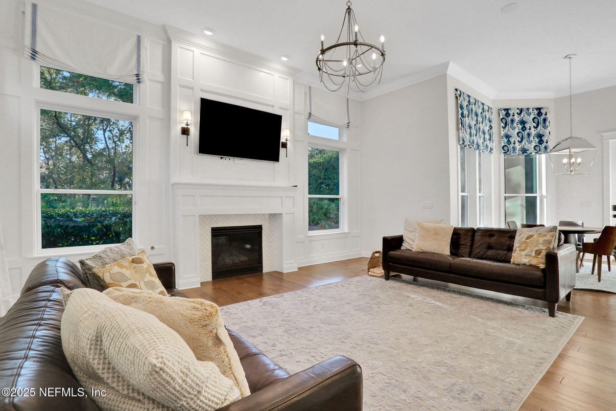 Chandelier, Dining room, Fireplace, Interior, Living room, Pendant Lights, Recessed Lighting, Wood Texture Flooring