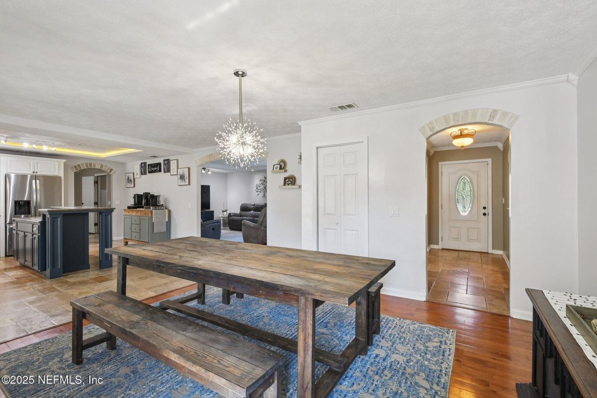 Chandelier, Dining room, Interior, Kitchen, Pendant Lights, Stainless Steel Appliances, Wood Texture Flooring