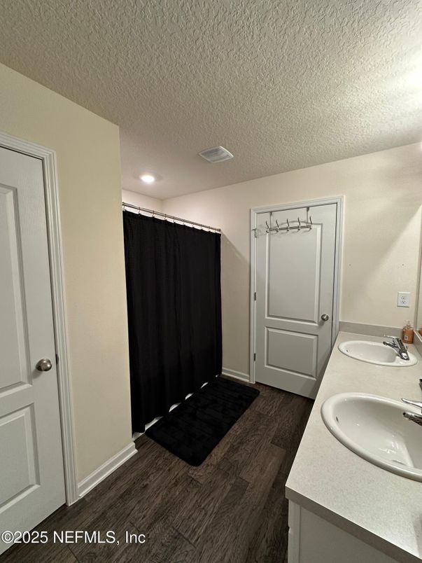 Bathroom, Dual Sink Vanities, Interior, Recessed Lighting, Wood Texture Flooring