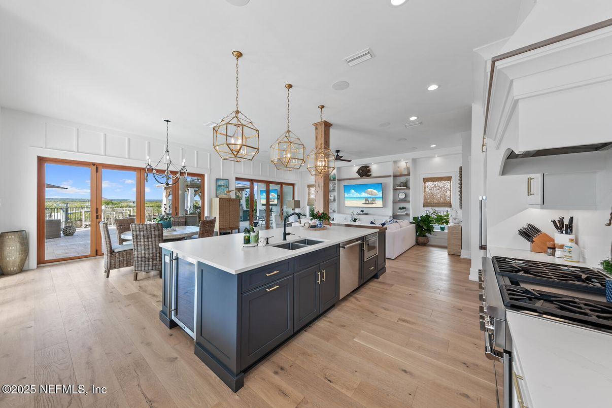 Chandelier, Dining room, Interior, Kitchen, Pendant Lights, Recessed Lighting, Stainless Steel Appliances, Wood Texture Flooring