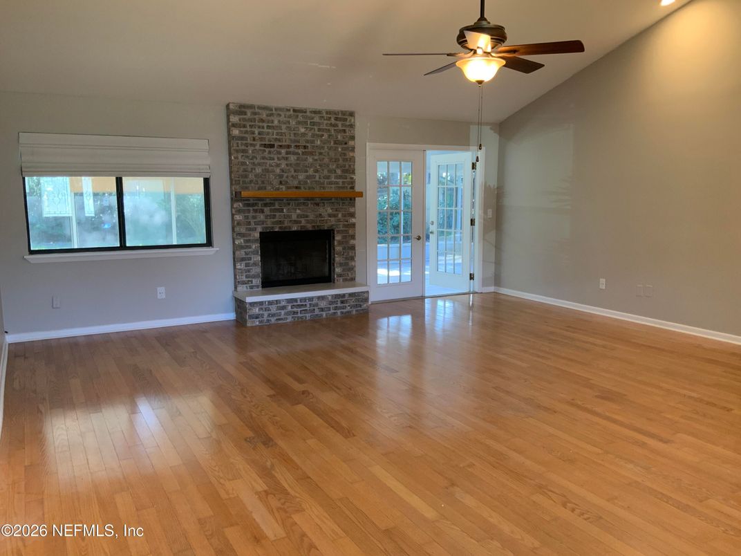 Empty room, Fireplace, Interior, Recessed Lighting, Stone Walls, Wood Texture Flooring